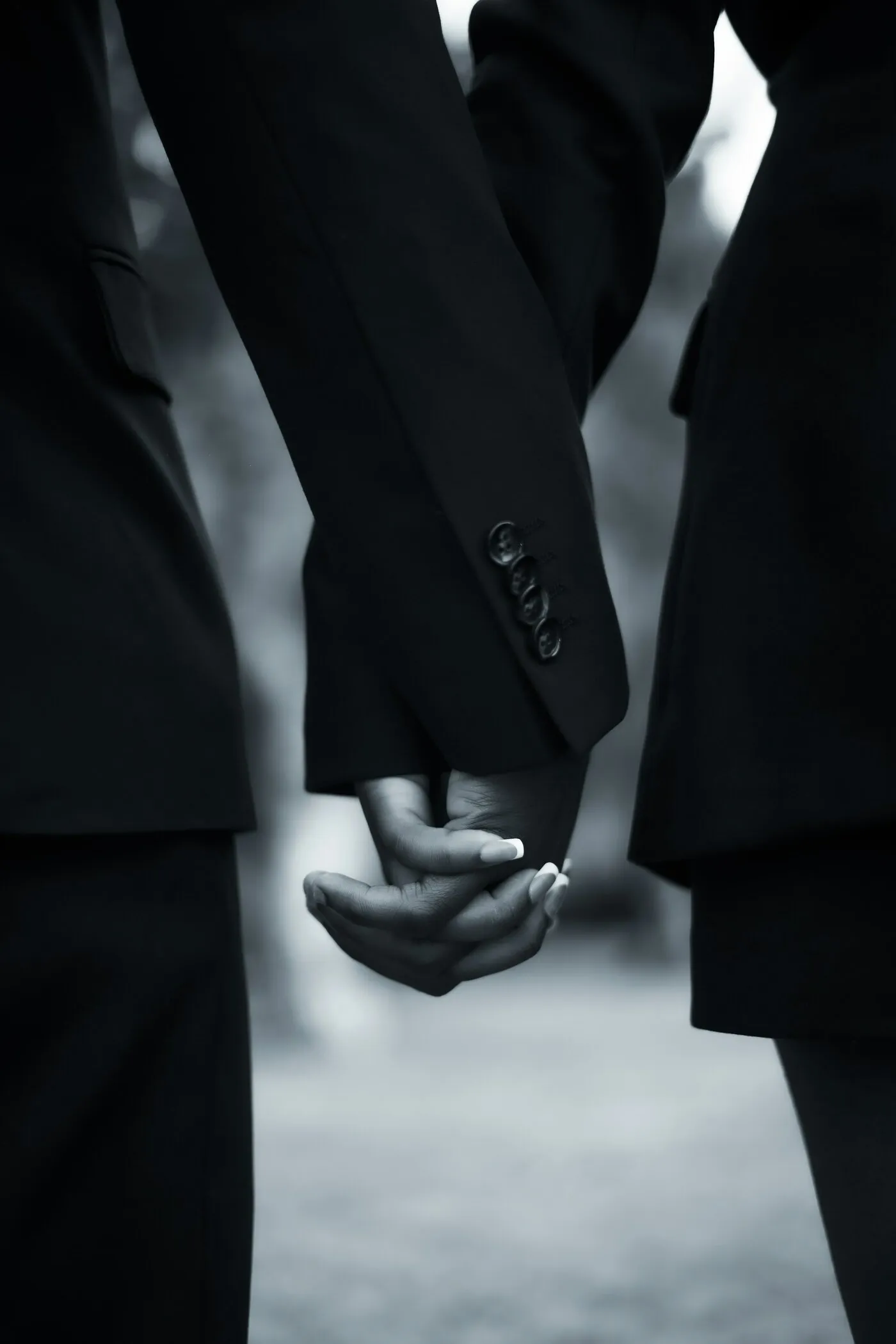 Close protection officers in dark suits